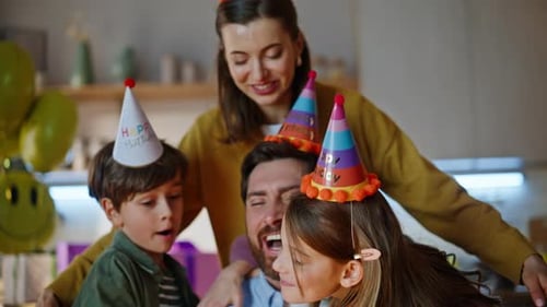 Family Celebrating Birthday Together at Home