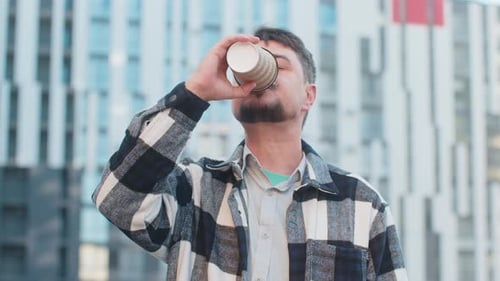 Happy Caucasian Middleaged Man Tourist Enjoying Morning Coffee Hot Drink on City Downtown Street