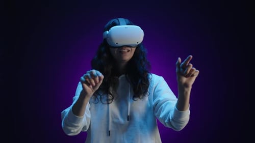 Woman Using VR Headset Interacting in Digital Space