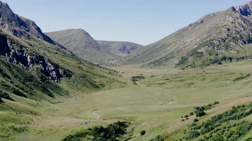 View from the high track in caucasus mountains glaciers, green grass, wild lakes