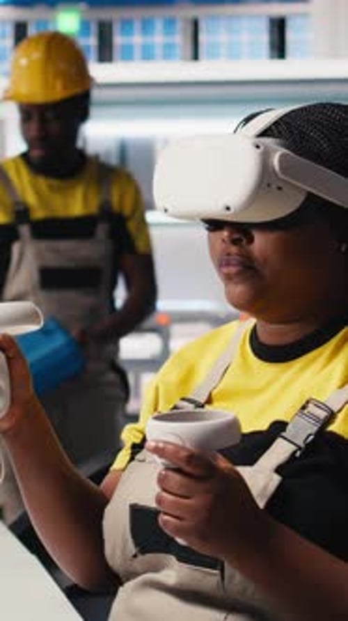Vertical Video Black Engineer in Photovoltaics Factory Uses Virtual Reality Equipment