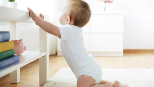 Childhood, Babyhood and People Concept - Happy Little Baby Crawling in Living