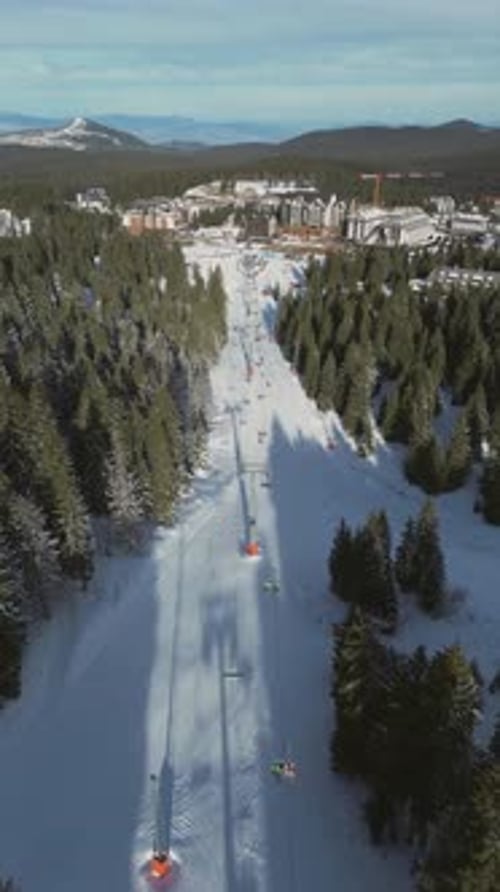 Alpine Ski Lift Aerial Drone View in Kopaonik Serbia Chairlift at Ski Resort Mountain Winter Forest