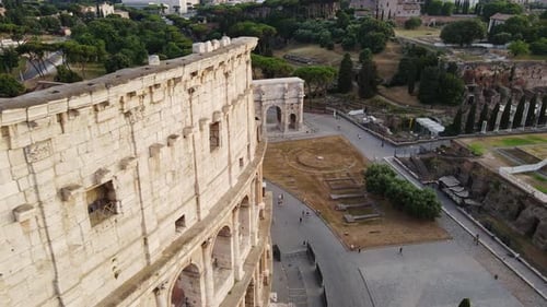 Aerial Sunset Flyby of Rome’s Colosseum and Arch of Constantine, Rome, Italy