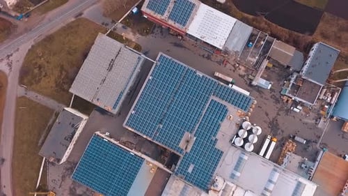 Solar panels on roof. Top down view of solar panels pv cells on factory roof