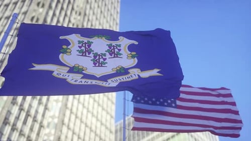 Connecticut State and USA Flags Waving in Blue Sky