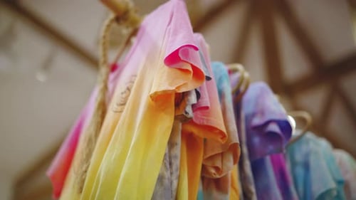El Nido, Philippines - Vibrant Colored Dyed Shirts Hanged And Air Dried On A Wooden Clothesline - Cl