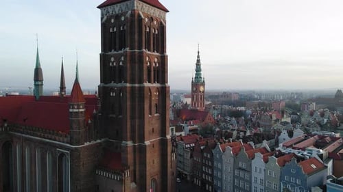 Drone shot of St. Mary's Church and Gdansk Town Hall in the background