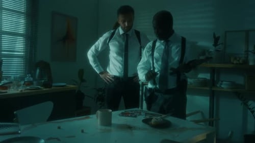 Two Men Investigate a Crime Scene at Night
