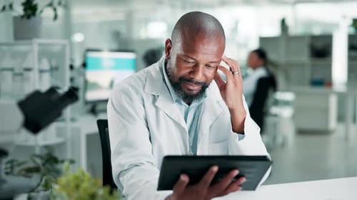 Scientist Using Tablet Device in Modern Laboratory