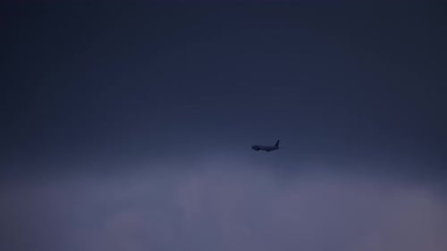 Airplane Silhouette in Evening Sky