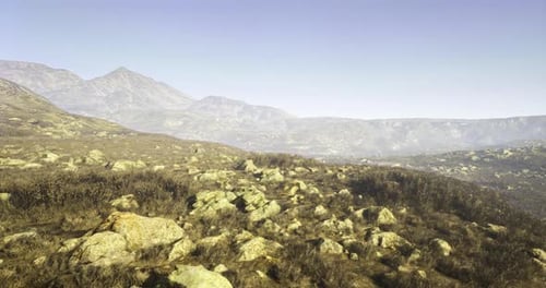 Aerial Flyover of Rocky Mountain Landscape with Scrubland
