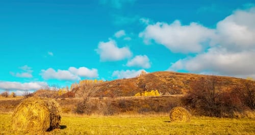 Mountain Meadow Timelapse at the Autumn Sunrise Time Wild Nature and Rural Haystacks on Grass Field