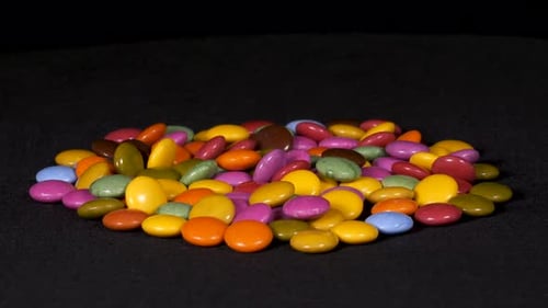 Multi-Colored Candies Piled on a Black Surface