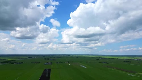 Aerial view of moving clouds and green landscape at Amersfoort, The Netherlands