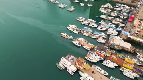 High aerial view travel cruise luxury yachts and boats in marina parking in sea pier neatly arranged