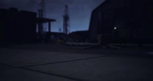 Nighttime Industrial Setting with Distant Structures and Low Visibility