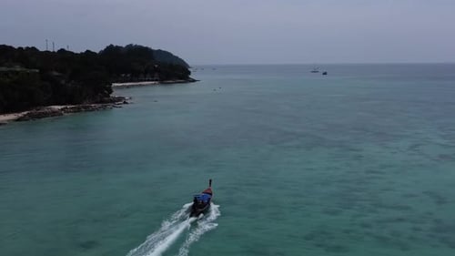 4k drone shot of fishing boat on koh lipe island, Thailand