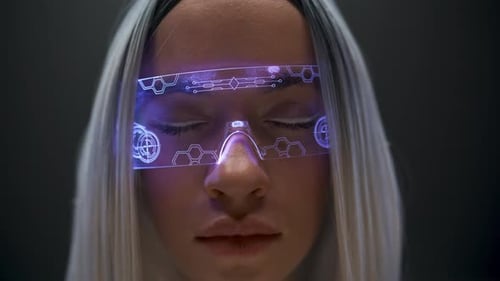 Woman with futuristic glasses in a technology setting