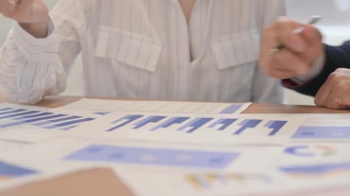 Business People Working on Documents in Office