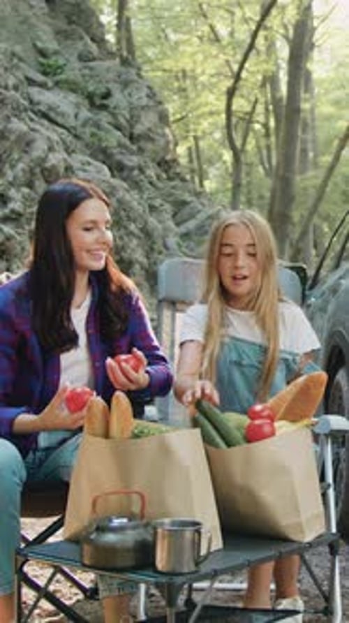 Happy Family Having Weekend Picnic Outdoors in the Forest Woman and Girl Preparing Food and Father