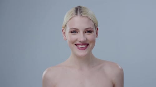Smiling woman with blonde hair in beauty shot