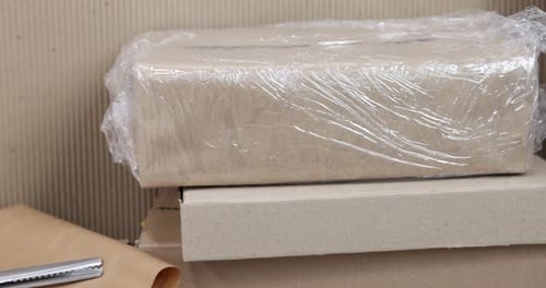 Close-up of Cardboard Boxes and Packaging Materials for Shipping