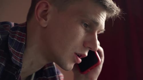 Man Close Up Talking on a Cellphone