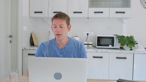 Man Working At Home On A Video Call