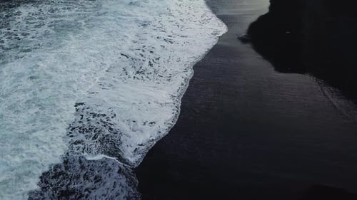 Waves Crashing on Black Sand Beach in Iceland