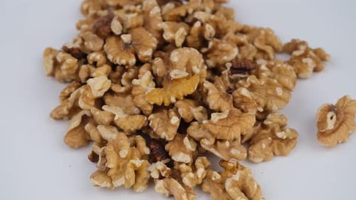 Pile of Delicious Walnuts on White Background