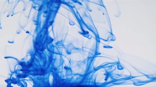 Abstract Blue Dye Swirling in Clear Liquid
