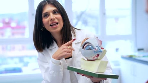 Woman Explains Anatomy of Human Eye Model
