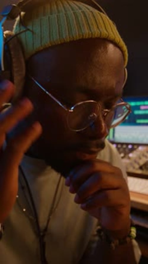 Man in Music Studio with Headphones and Beanie