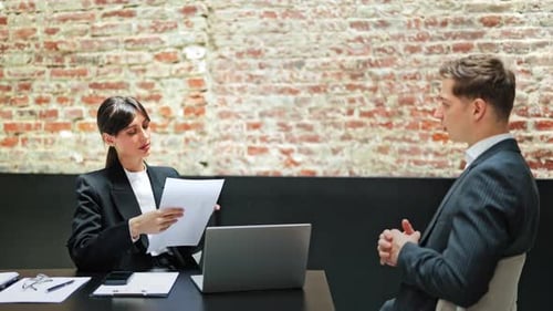 Business Meeting Businesswoman and Businessman Discuss Strategy in Modern Office