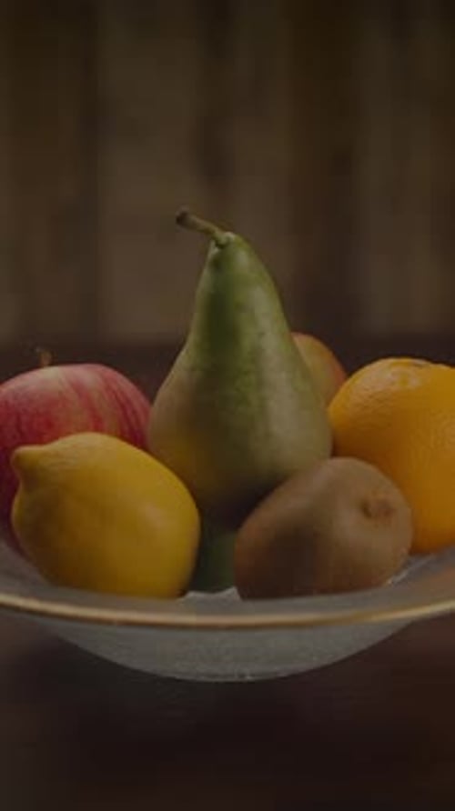 Still life fruit bowl with pears, lemons, oranges