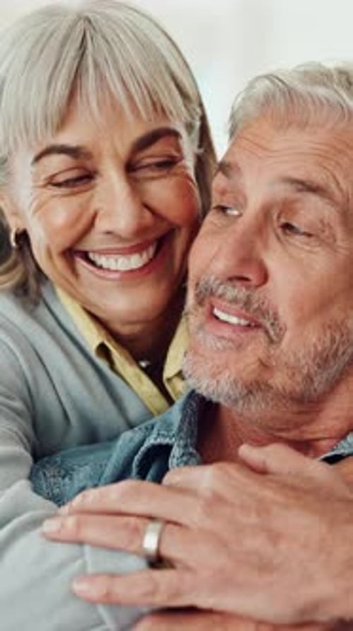 Smiling Senior Couple Embracing in a Close-Up Portrait