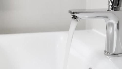 Water Running From Faucet Closeup