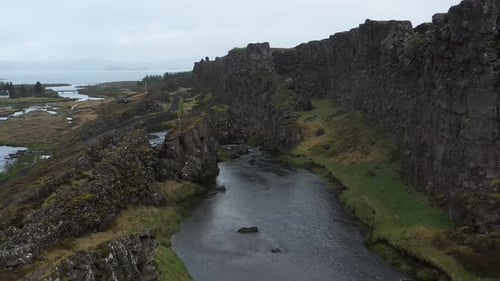 Majestic River Flowing Through Basalt Columns