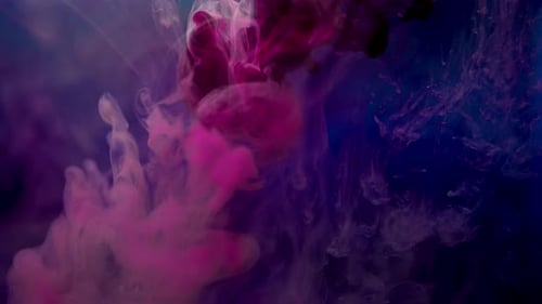 Vibrant Pink and Purple Ink Swirls in Space