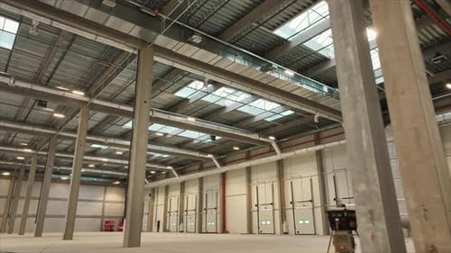 Horizontal Shooting of Modern Big Empty Area Industrial Room for Keeping Things Inside of Building