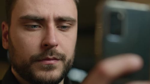 Focused Caucasian Man Guy Hold Mobile Phone Close Up Male Face Businessman Employer Using Smartphone