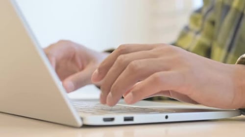 Hands of African Man Working on Laptop, Close up