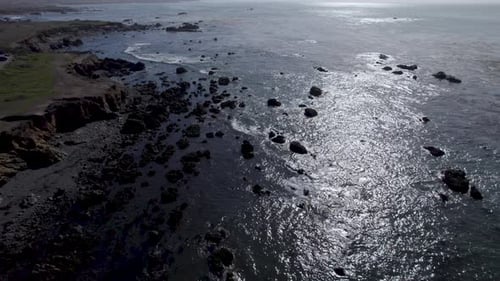 Glistening Water Of The Pacific Coast At Sunrise In Cambria and San Simeon, California, United State