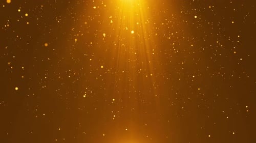 Puntos de luz de partículas doradas dispersos en el fondo del escenario