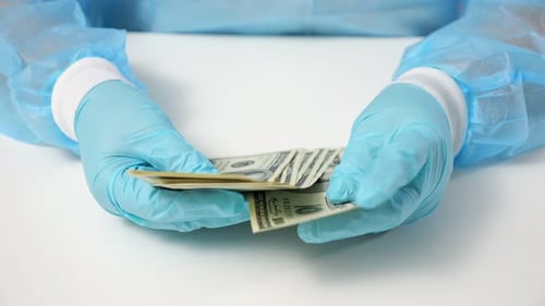 Hands with Gloves Counting Hundred Dollar Bills