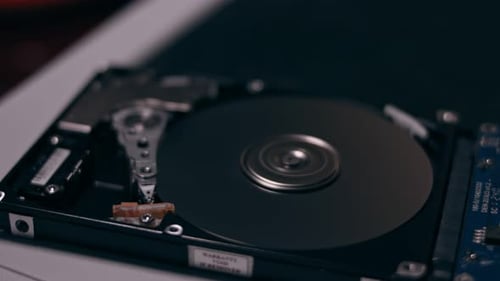 Macro Close Up of Working Opened Hdd Drive Hard Disk Move of Writing Reading Magnetic Head