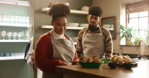 Couple Cooking Together in a Sunny Kitchen