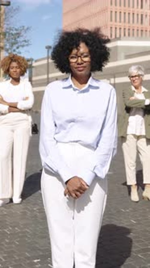 Confident Business Women Standing in Urban Setting