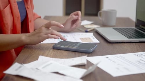 Doing Finances with Laptop and Smartphone Calculator